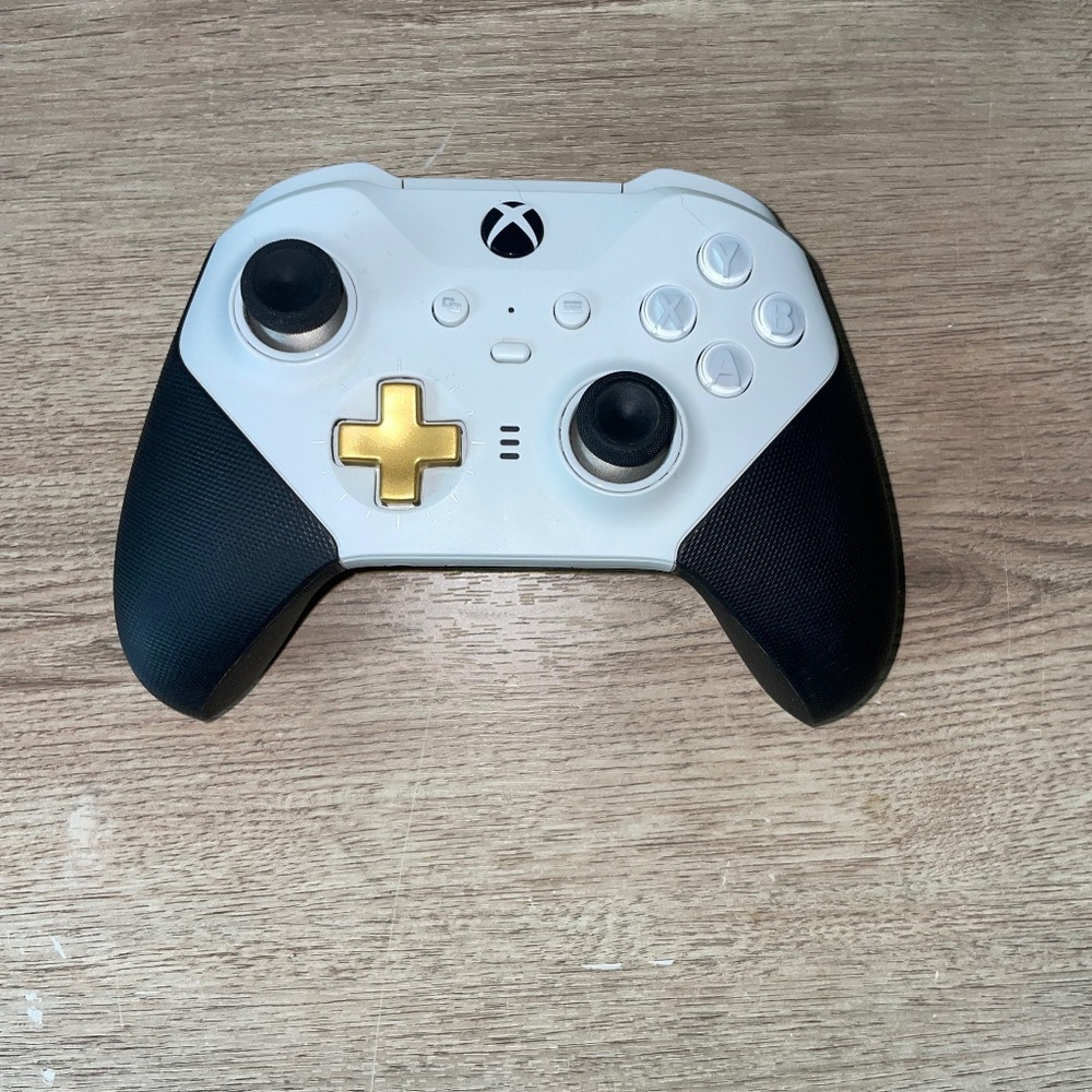 White and Black Xbox Controller with Gold D-Pad